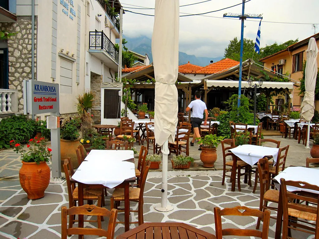 EMPTY TABLES AT THE TAVERNA. THASSOS GREECE